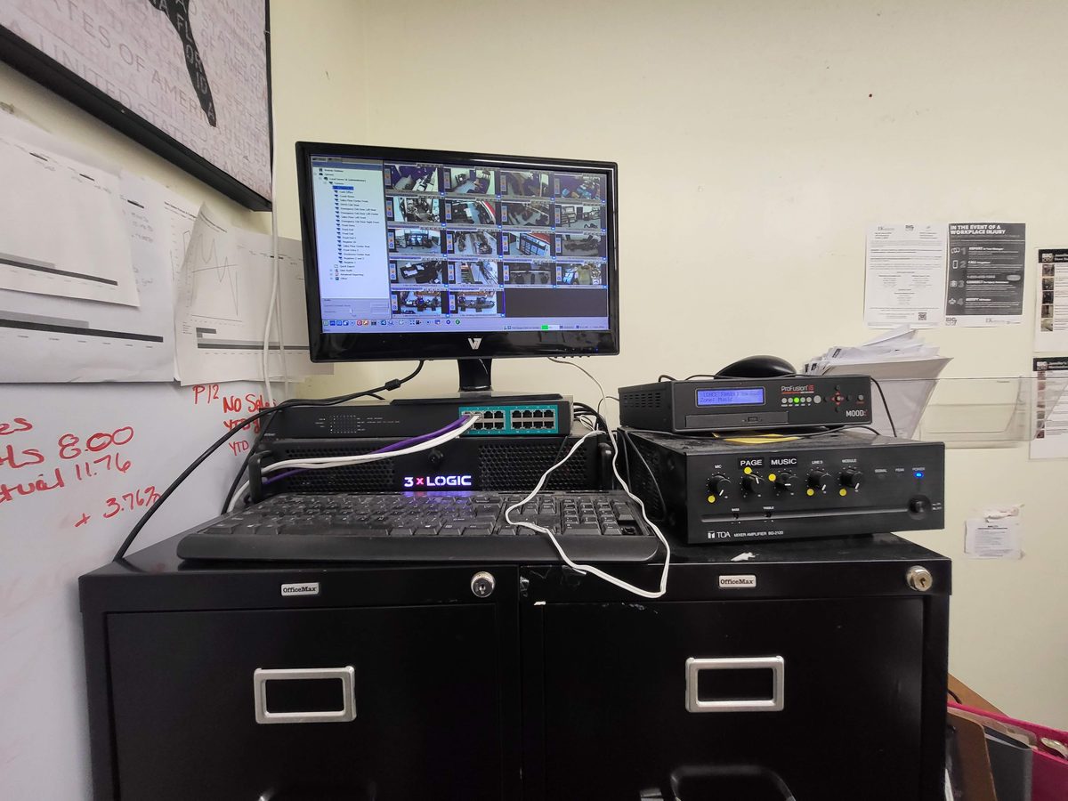 3xLogic NVR security system with network switch and monitoring display