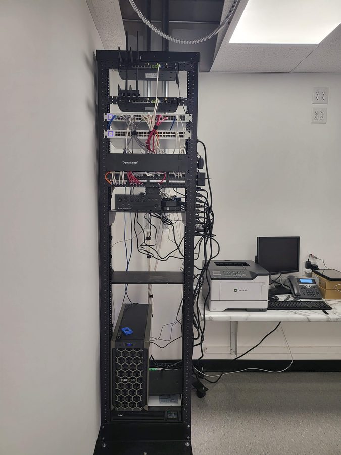 Server rack with networking equipment during retail store IT buildout