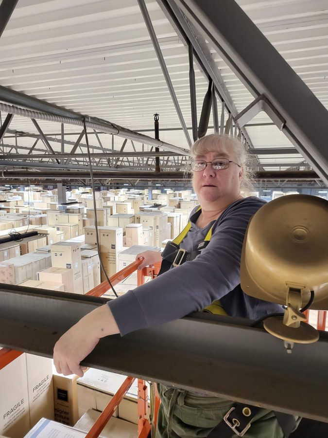 DR TEC technician running cable in warehouse distribution facility